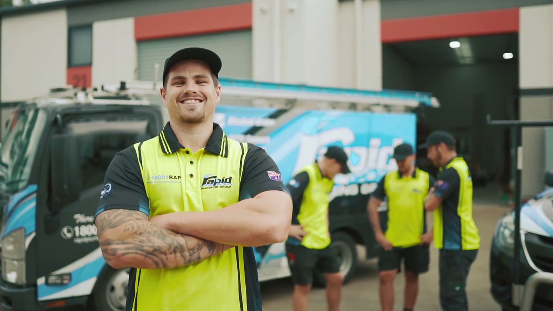 Rapid Plumbing Group plumber in front of a branded service van in Sydney
